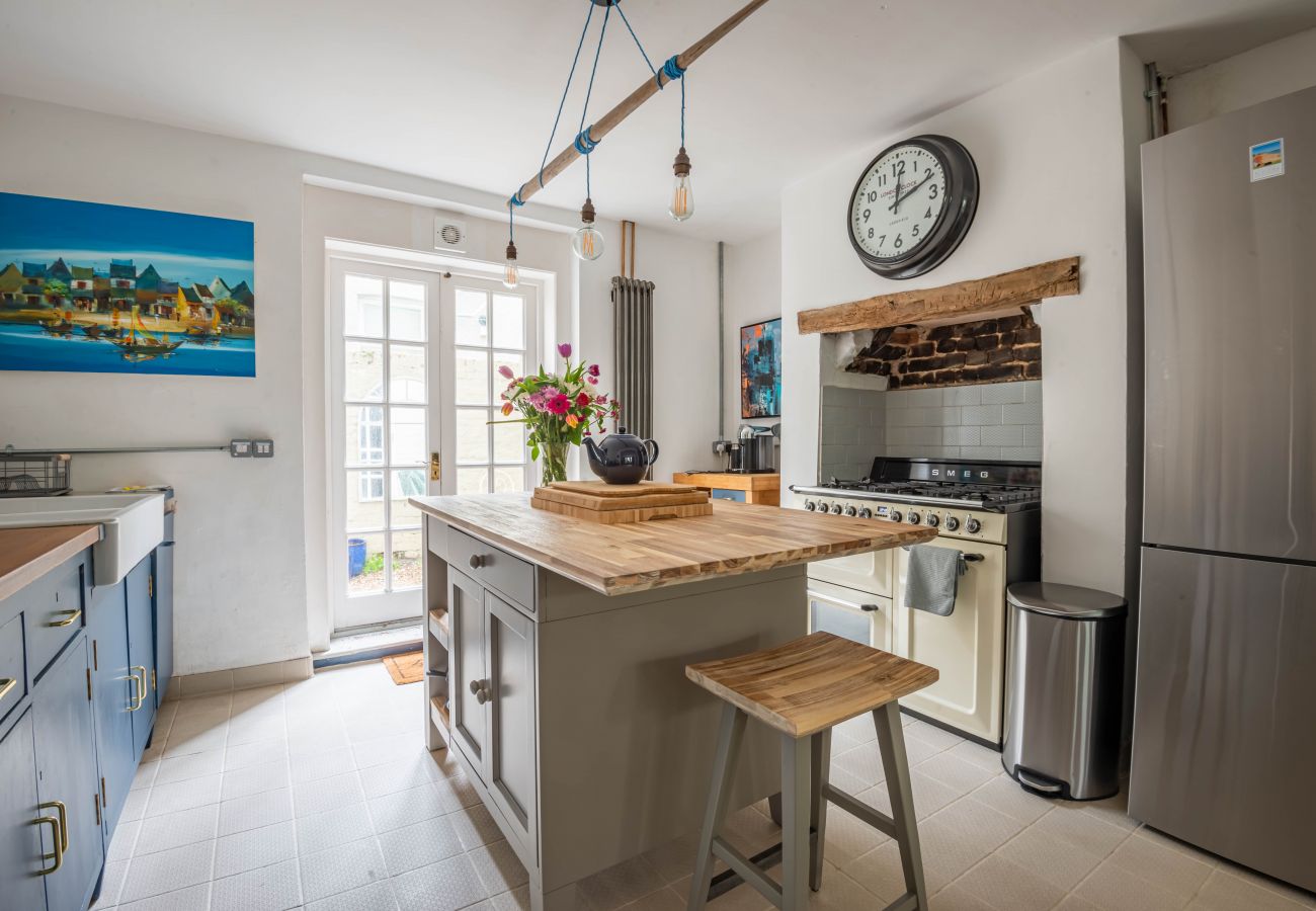 Kitchen with island and doors towards the dining room