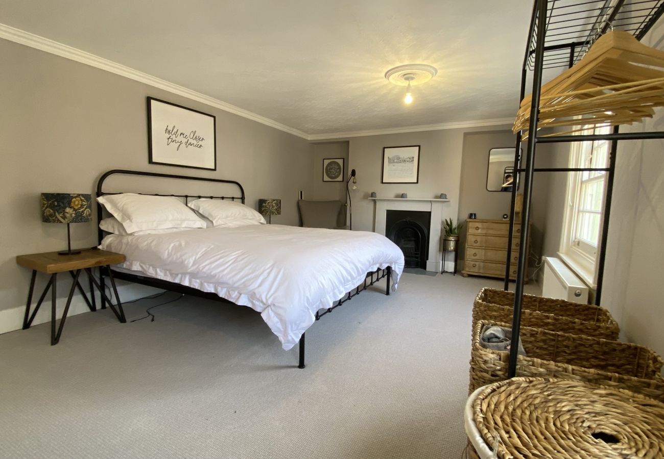 Principal bedroom with dressing area and clothes rail
